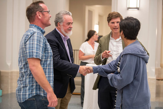 Center from Left: Ray Offenheiser, director, and Michael Sweikar, executive director, greet two of NDIGD's inaugural Faculty Fellows. 